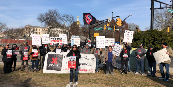 CEASE casino workers with signs
