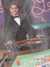 Photo of a casino dealer in a smoke-filled casino